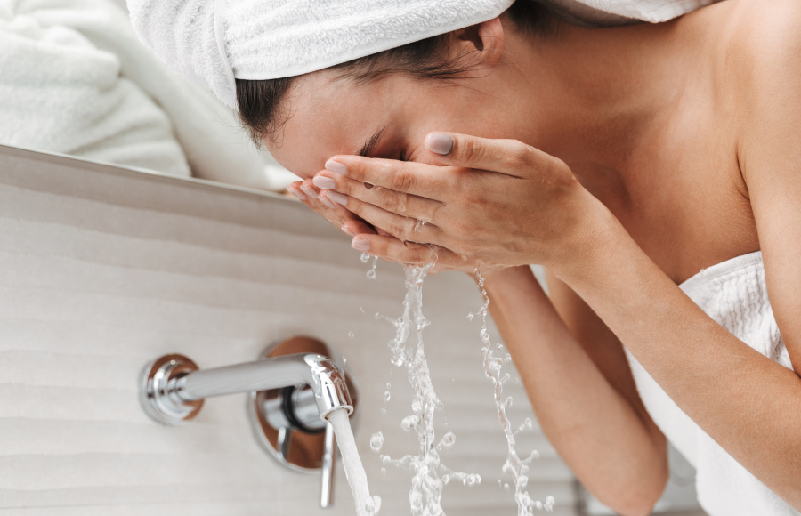 Woman washing her face