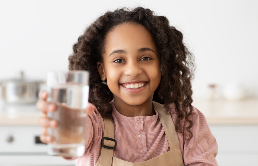 Girl with glass of water